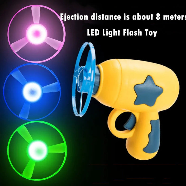 LED light pet toy launcher with vibrant flying discs for dogs and cats.