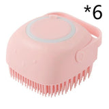 Silicone dog bath massage glove brush in pink with soft bristles for pet grooming.