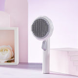 New pet cat brush with steel wire, self-cleaning comb design for hair removal.