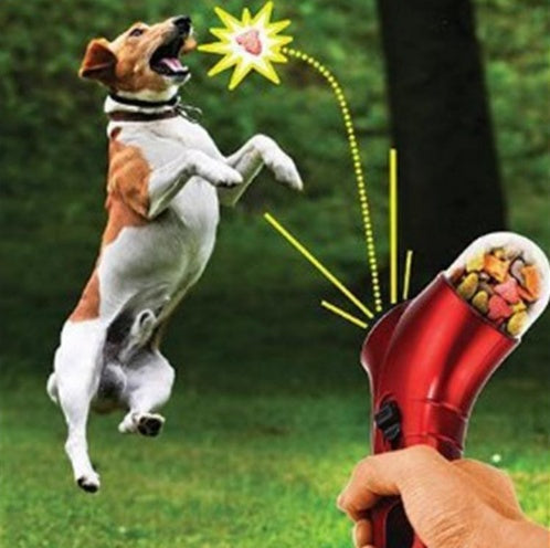 Pet Food Catapult launching treats for a dog to catch in mid-air.