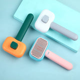 Pet cat dog hair brush in smoke grey, blue pink, and orange green; stainless steel comb for grooming and massage.