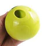 Pet food feeder dispenser toy with hole for treats, green ball design.