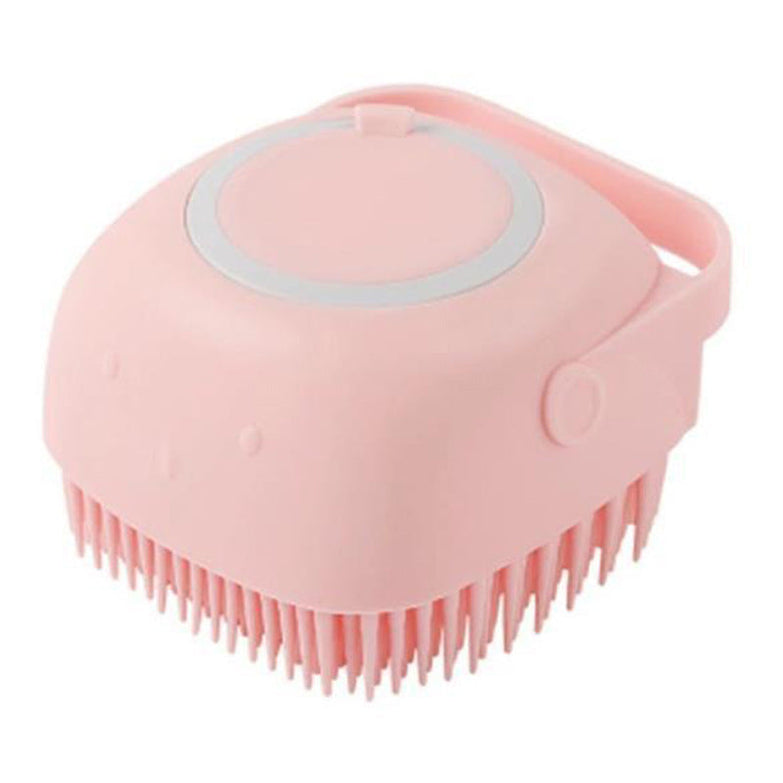 Silicone dog bath massage glove brush in pink for pet grooming.