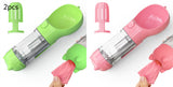 Portable pet water bottle feeder in green and pink with garbage bag holders, ideal for outdoor travel.