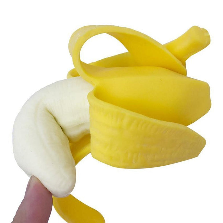 Interactive banana pet toy made of TPR material, yellow and white squeeze design.