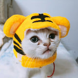 Curly Hair Pet Hat in a cartoon design on a cat, plush material, yellow with black stripes, cute dress-up accessory.