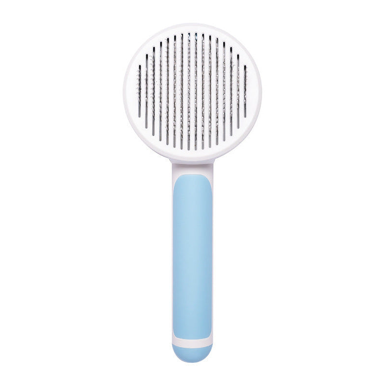 Hand-held steel wire pet cat brush in blue for hair removal and grooming.