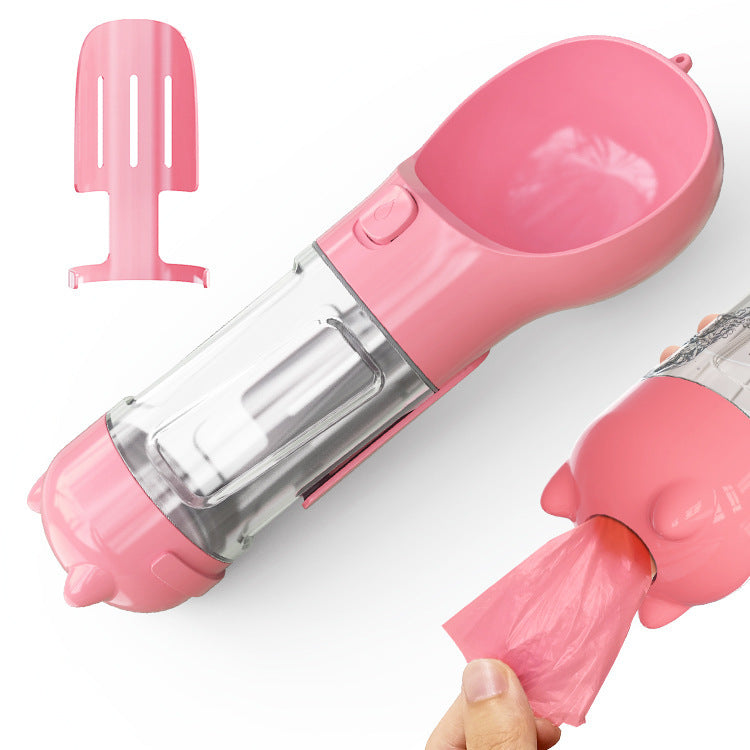 Portable pet water bottle feeder with attached bowl and garbage bag storage, ideal for outdoor travel, in pink.