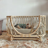 Handmade rattan pet bed sofa with cushion for dogs.