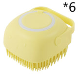 Silicone dog bath massage glove brush in yellow, ideal for grooming pets and applying shampoo.