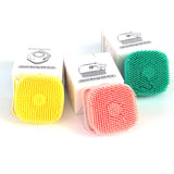 Silicone dog bath massage gloves in yellow, pink, and green.