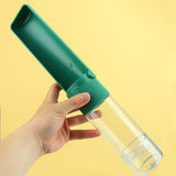 Portable pet water bottle with collapsible drinking bowl for dogs and cats, ideal for outdoor travel.