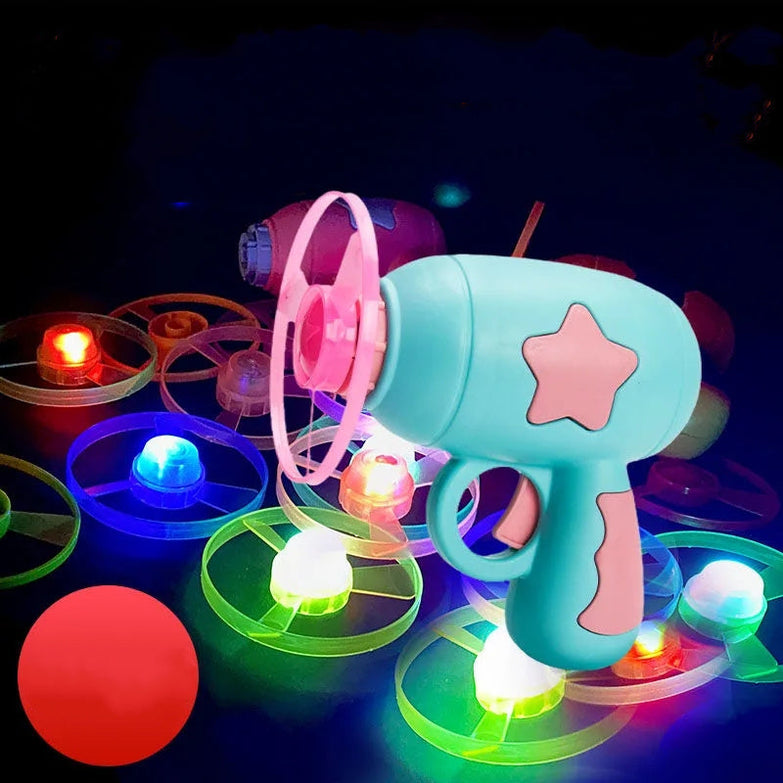 Pet toy LED light launcher with colorful flying discs for dogs and cats.