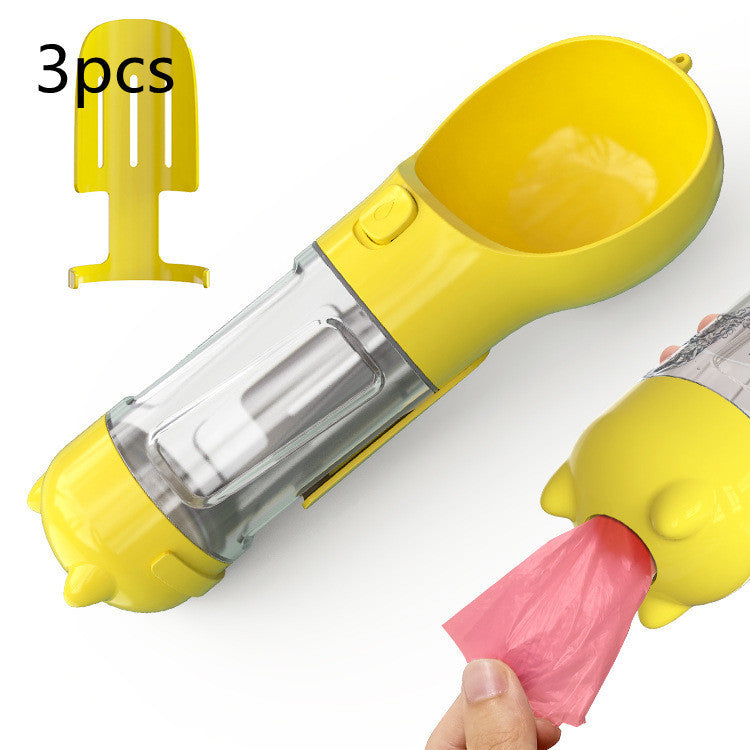 Portable 3-in-1 pet water bottle, feeder, and garbage bag storage in yellow for outdoor travel.