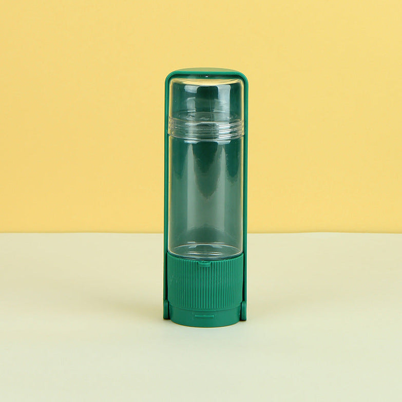 Portable pet water bottle in malachite green for outdoor travel.